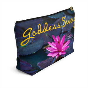 Goddess Swag Bag Mini called Lotus Love.  Bag can be used as an accessory bag, makeup or cosmetic bag.  One side of bag shows a pink lotus with lily pad background and goddess swag writing in gold above the lotus.  The other side of the bag shows the pink lotus and lily pad background only.