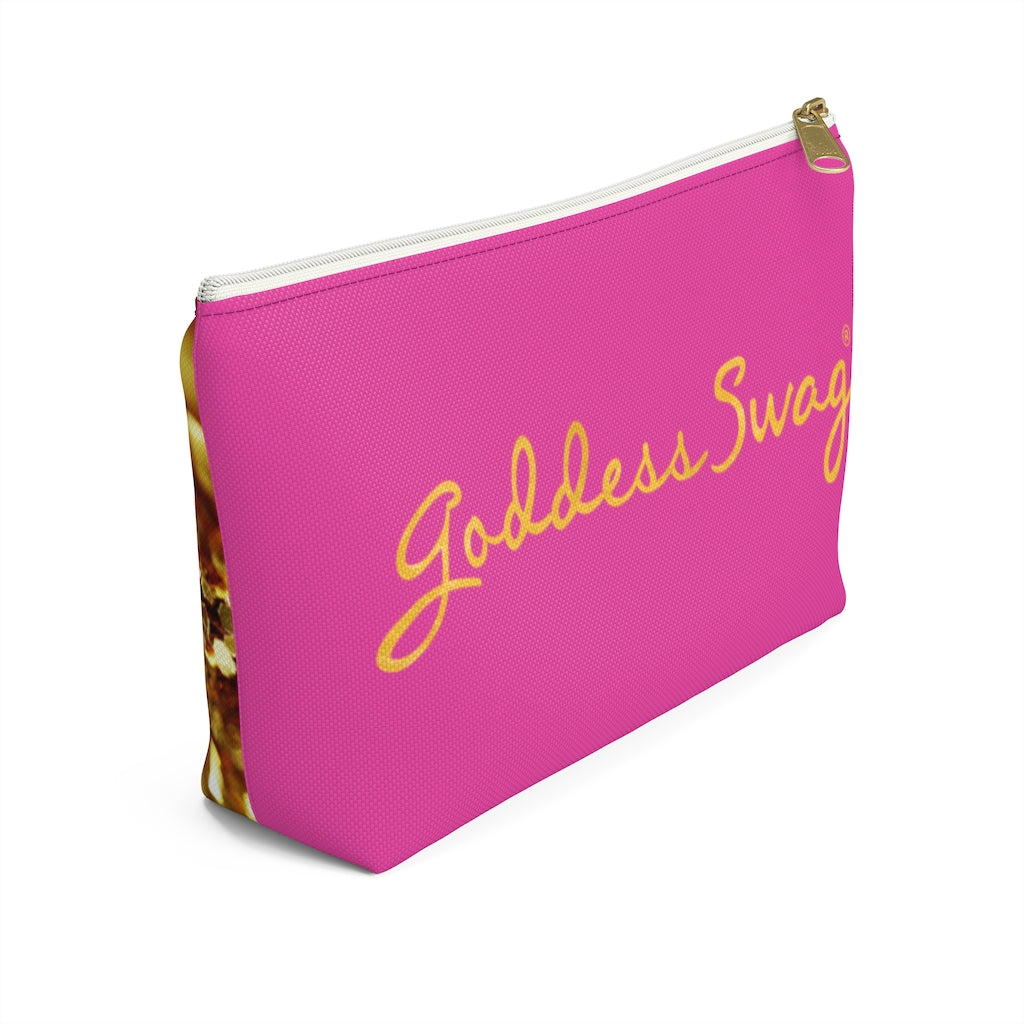 Goddess Swag Bag Mini (named sparkle).  Item can be used as accessory pouch, makeup bag or cosmetic bag. Background is pink on one side with Goddess Swag wording in gold over the pink, and a gold sparkle image on the other side of the bag.  There is an option of a black or a white zipper, and a large or a small bag. 