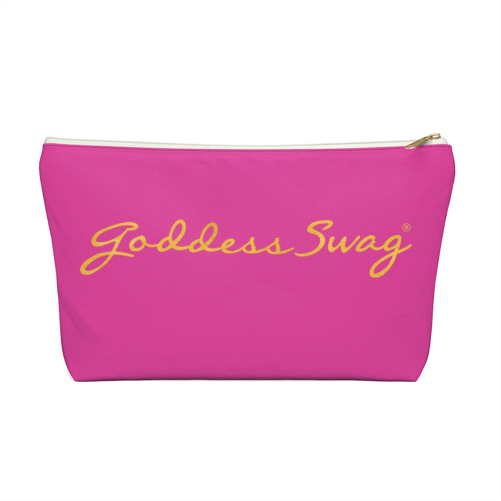 Goddess Swag Bag Mini (named sparkle).  Item can be used as accessory pouch, makeup bag or cosmetic bag. Background is pink on one side with Goddess Swag wording in gold over the pink, and a gold sparkle image on the other side of the bag.  There is an option of a black or a white zipper, and a large or a small bag. 