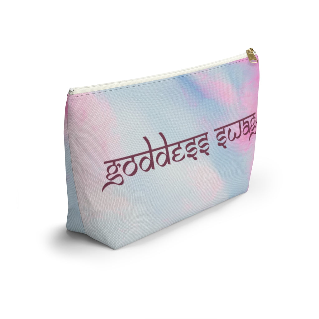 Goddess Swag Bag Mini Ethereal Dream Pastel cotton candy colors with goddess swag written sanskrit style in deep purple.  Item can be used as accessory pouch, makeup bag or cosmetic bag. Goddess Swag wording is on one side of the bag only. There is an option of a black or a white zipper, and a large or a small bag.