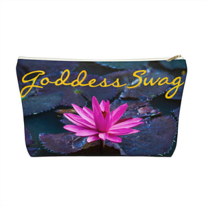 Goddess Swag Bag Mini called Lotus Love.  Bag can be used as an accessory bag, makeup or cosmetic bag.  One side of bag shows a pink lotus with lily pad background and goddess swag writing in gold above the lotus.  The other side of the bag shows the pink lotus and lily pad background only.
