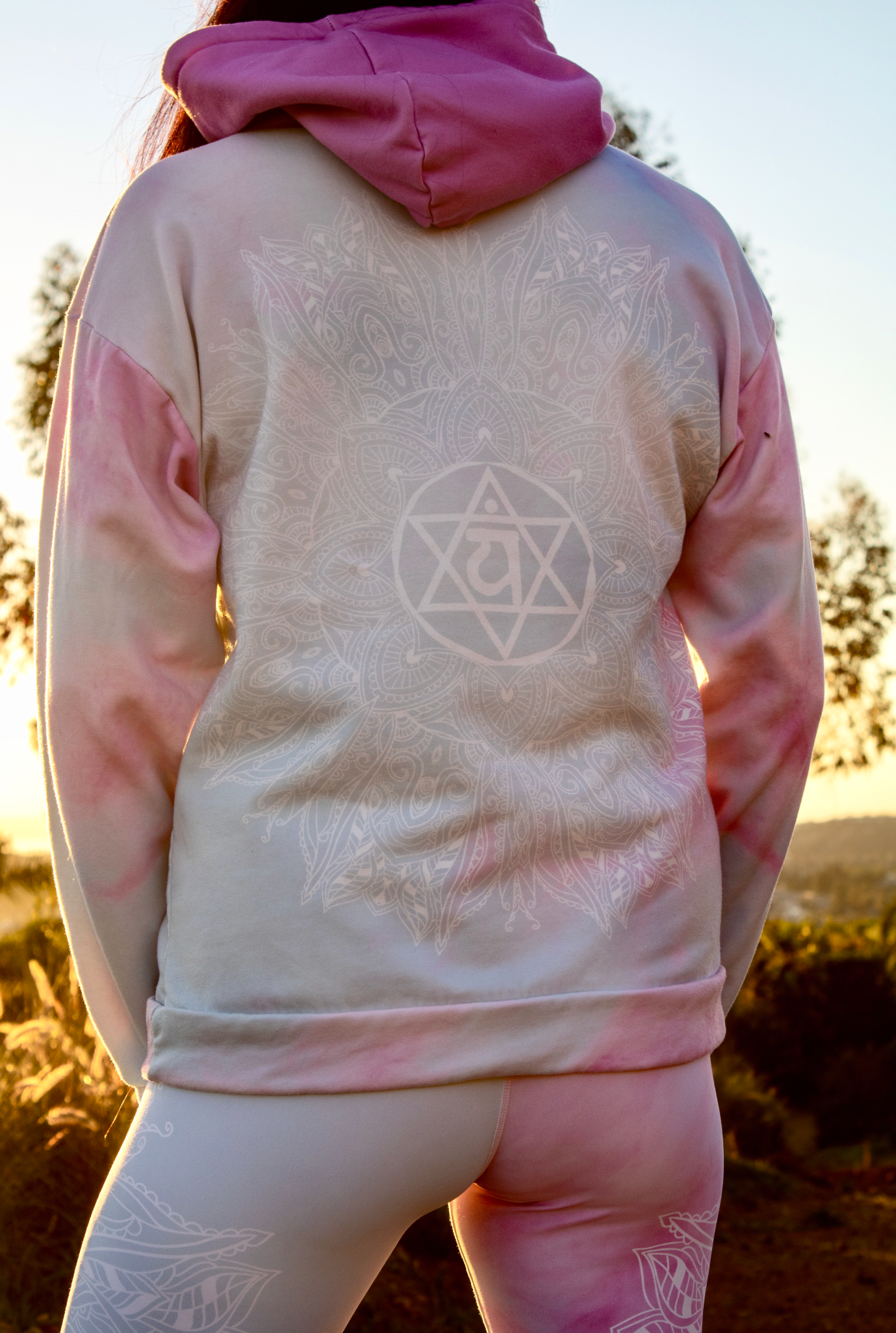 Ethereal Heart Chakra Mandala Hoodie by Goddess Swag pastel background of blue pink and white with medium pink hood color.  heart chakra mandala design in white on back and white mandala design on front