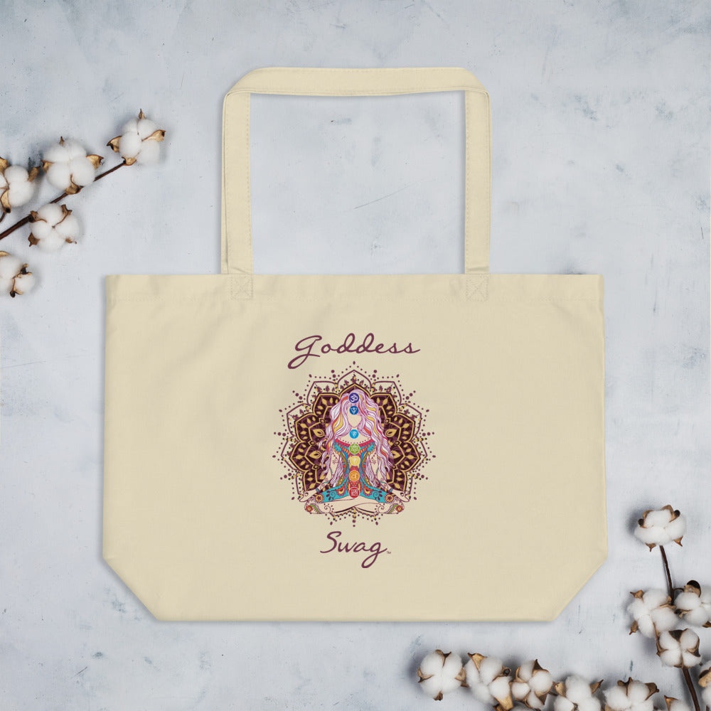  Goddess Swag, Large Eco Tote Bag Organic Cotton Oyster Color with Mandala and Chakra Design by Goddess Swag which is written in deep purple color.