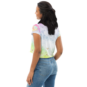 short sleeve crop top tee shirt pastel tie dye background with seed of life design in gold  on front.  Left sleeve has a hexagon and right has a star tetrahedron symbol.