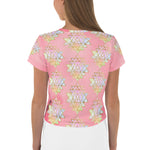 Load image into Gallery viewer, Light to medium pink background with pastel and gold color sri yantra design all over front back and short sleeves.  This is a crop top tee by goddess swag as part of the cosmic powers collection

