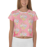 Load image into Gallery viewer, Light to medium pink background with pastel and gold color sri yantra design all over front back and short sleeves.  This is a crop top tee by goddess swag as part of the cosmic powers collection
