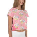 Load image into Gallery viewer, Light to medium pink background with pastel and gold color sri yantra design all over front back and short sleeves.  This is a crop top tee by goddess swag as part of the cosmic powers collection
