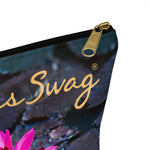 Load image into Gallery viewer, Goddess Swag Bag Mini called Lotus Love.  Bag can be used as an accessory bag, makeup or cosmetic bag.  One side of bag shows a pink lotus with lily pad background and goddess swag writing in gold above the lotus.  The other side of the bag shows the pink lotus and lily pad background only.
