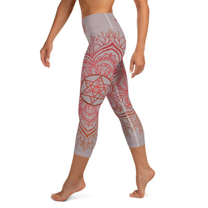 Yoga capri leggings midcalf length by Goddess Swag.  Background solid color is a medium grey. design overlay in front and back is a red mandala print for the earth star chakra.  On front waist is the earth star chakra centered. On back waist is goddess swag written out in red.