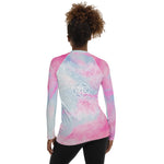 Load image into Gallery viewer, long sleeve rash guard  UPF 50 sun protection.  Design is white mandala on the front chest and white heart chakra mandala on the back. The background is a soft pastel of pink and blue by goddess swag.
