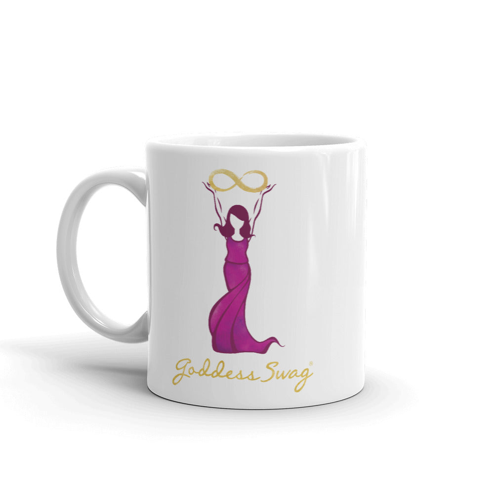 Goddess Swag Signature Logo Ceramic Coffee Mug 11oz with goddess holding  a gold infinity design above her head.  Her dress is magenta.  Goddess Swag is written ion gold.