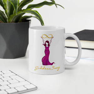 Goddess Swag Signature Logo Ceramic Coffee Mug 11oz with goddess holding  a gold infinity design above her head.  Her dress is magenta.  Goddess Swag is written ion gold.