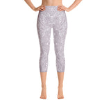 Load image into Gallery viewer, mystic-77-heart-chakra-mandala-capri-leggings-by-goddess-swag.  Background color is a light to medium mauve.  The mandala design is white and all over front and back. Goddess Swag is written on the back waistband in sanskrit style in a deep purple.
