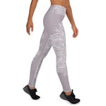 Load image into Gallery viewer, full length yoga legging from collection mystic mandala by goddess swag.  the design is a heart chakra symbol and mandala blown out on the front and back in white.  The front waistband has the 6 pointed star chakra design and the back waistband has goddess swag written. The background color os a solid light mauve gray.
