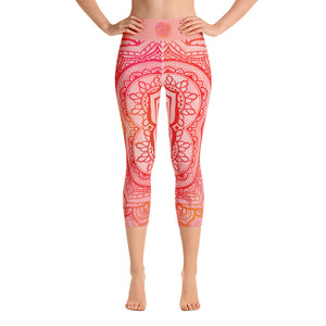 capri mid calf leggings. design is root chakra mandala of orange and red on legs front and back.  the front waistband has the root chakra symbol in the center while the back has goddess swag written on the waist band.