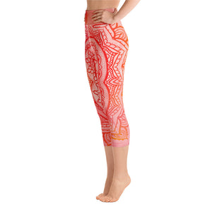 capri mid calf leggings. design is root chakra mandala of orange and red on legs front and back.  the front waistband has the root chakra symbol in the center while the back has goddess swag written on the waist band.