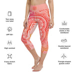 Load image into Gallery viewer, capri mid calf leggings. design is root chakra mandala of orange and red on legs front and back.  the front waistband has the root chakra symbol in the center while the back has goddess swag written on the waist band.
