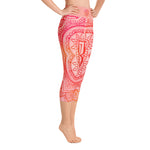 Load image into Gallery viewer, capri mid calf leggings. design is root chakra mandala of orange and red on legs front and back.  the front waistband has the root chakra symbol in the center while the back has goddess swag written on the waist band.
