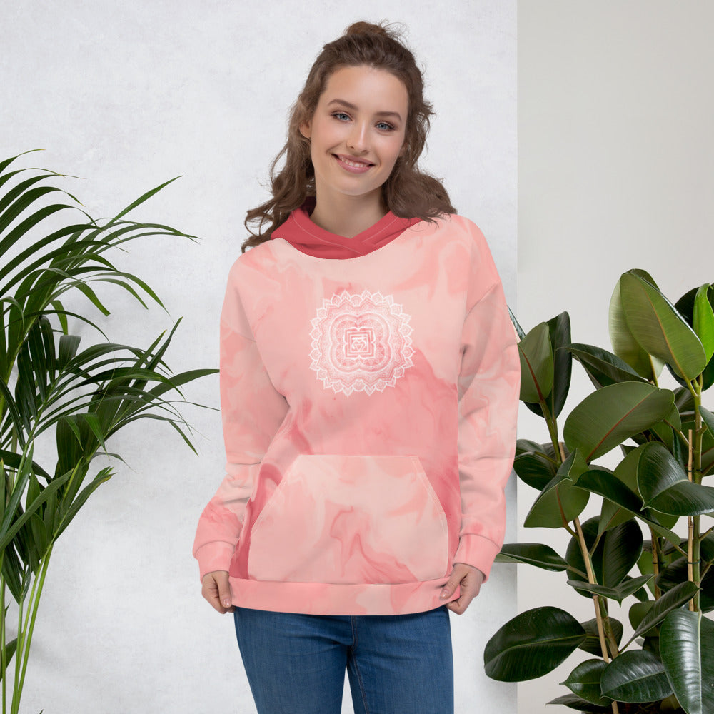 root chakra mandala design on front and back of hoodie by goddess swag.  Design is red and orange and the hood is a medium solid pink.  the background is a pinkish peach light tie dye.