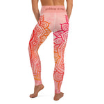 Load image into Gallery viewer, Full length leggings. Coloring is light pink, orange and red for the root chakra, front and back.  the waist band has the root chakra mandala design.  the back waist band has goddess swag written in sanskrit style font. Designed by goddess swag.
