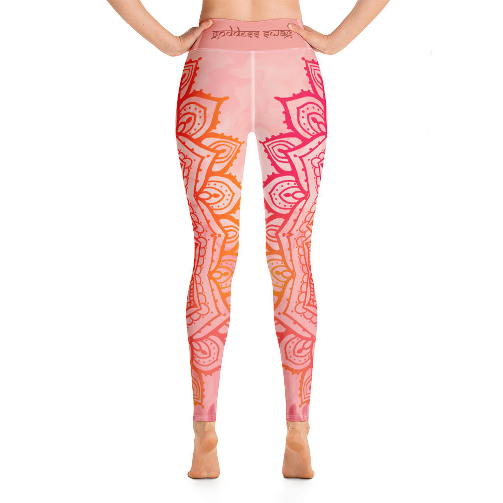 Full length leggings. Coloring is light pink, orange and red for the root chakra, front and back.  the waist band has the root chakra mandala design.  the back waist band has goddess swag written in sanskrit style font. Designed by goddess swag.