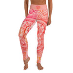 Load image into Gallery viewer, Full length leggings. Coloring is light pink, orange and red for the root chakra, front and back.  the waist band has the root chakra mandala design.  the back waist band has goddess swag written in sanskrit style font. Designed by goddess swag.
