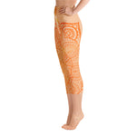Load image into Gallery viewer, yoga capri leggings by goddess swag. Design is a sacral chakra mandala on front and back of leggings in deep orange and light yellow coloring.  Back waist has goddess swag written in light gold. mid calf legging length.

