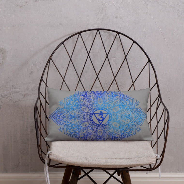 lumbar throw pillow insert and cover. the cover has a third eye chakra mandala design in blue on a gray background by goddess swag.  the pillow is reversible with design on both sides.