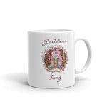 Load image into Gallery viewer, Goddess Swag, ceramic coffee mug 11 ounces. Goddess with Mandala behind her and seven colorful chakras from root to crown. She is sitting in lotus position. Goddess Swag which is written in deep purple color.
