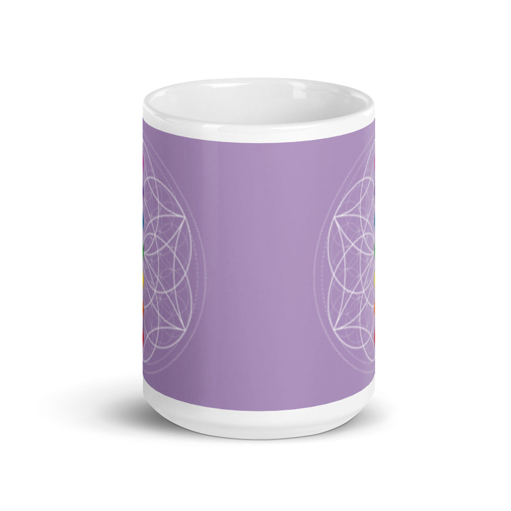 Spirit Quartz Crown chakra ceramic coffee mug design is a light purple background with sacred geometry and all seven chakras.  coffee mug is 15 ounces. By goddess swag