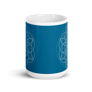Apatite throat chakra ceramic coffee mug design is a blue background with sacred geometry and all seven chakras.  coffee mug is 15 ounces. By goddess swag