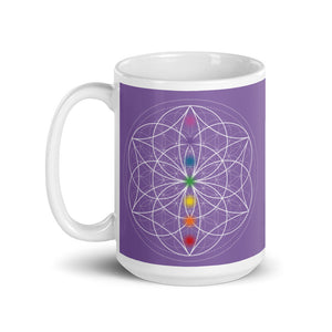 Amethyst third eye chakra ceramic coffee mug design is a light purple background with sacred geometry and all seven chakras.  coffee mug is 15 ounces. By goddess swag