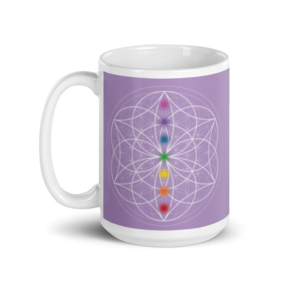 Spirit Quartz Crown chakra ceramic coffee mug design is a light purple background with sacred geometry and all seven chakras.  coffee mug is 15 ounces. By goddess swag