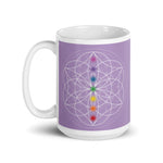 Load image into Gallery viewer, Spirit Quartz Crown chakra ceramic coffee mug design is a light purple background with sacred geometry and all seven chakras.  coffee mug is 15 ounces. By goddess swag
