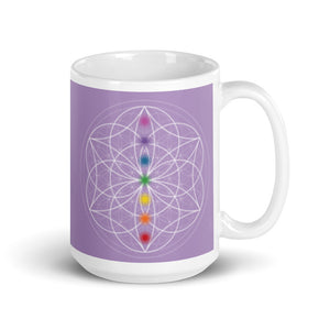 Spirit Quartz Crown chakra ceramic coffee mug design is a light purple background with sacred geometry and all seven chakras.  coffee mug is 15 ounces. By goddess swag
