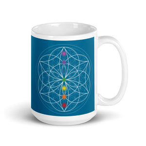 Apatite throat chakra ceramic coffee mug design is a blue background with sacred geometry and all seven chakras.  coffee mug is 15 ounces. By goddess swag